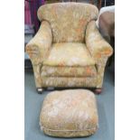 A late Victorian humpback armchair, 83cm high x 83cm wide x 85cm deep and poof both with floral