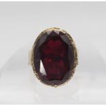 A 9ct gold retro large red gem set ring, size Q1/2, weight 9.6gms Condition Report:Available upon