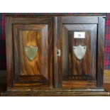 A Victorian rosewood smokers cabinet with hinged top over pair of doors concealing fitted