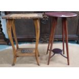 An early 20th century oriental hardwood two tier occasional table with carved top on carved faux