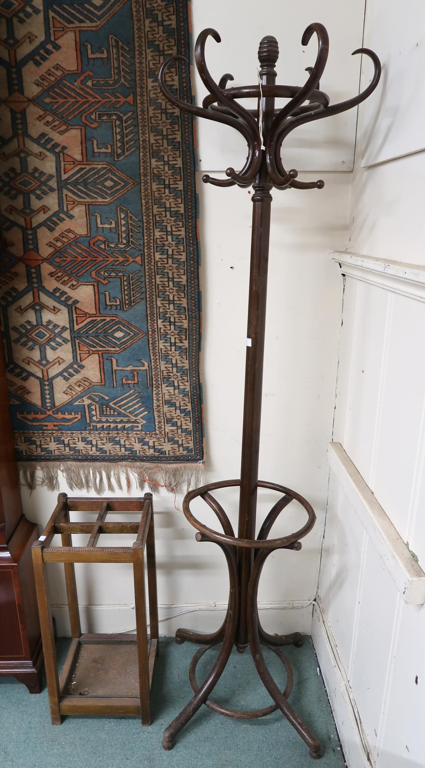 A late Victorian six branch bentwood hat and coat stand, 193cm high and an oak umbrella stand,