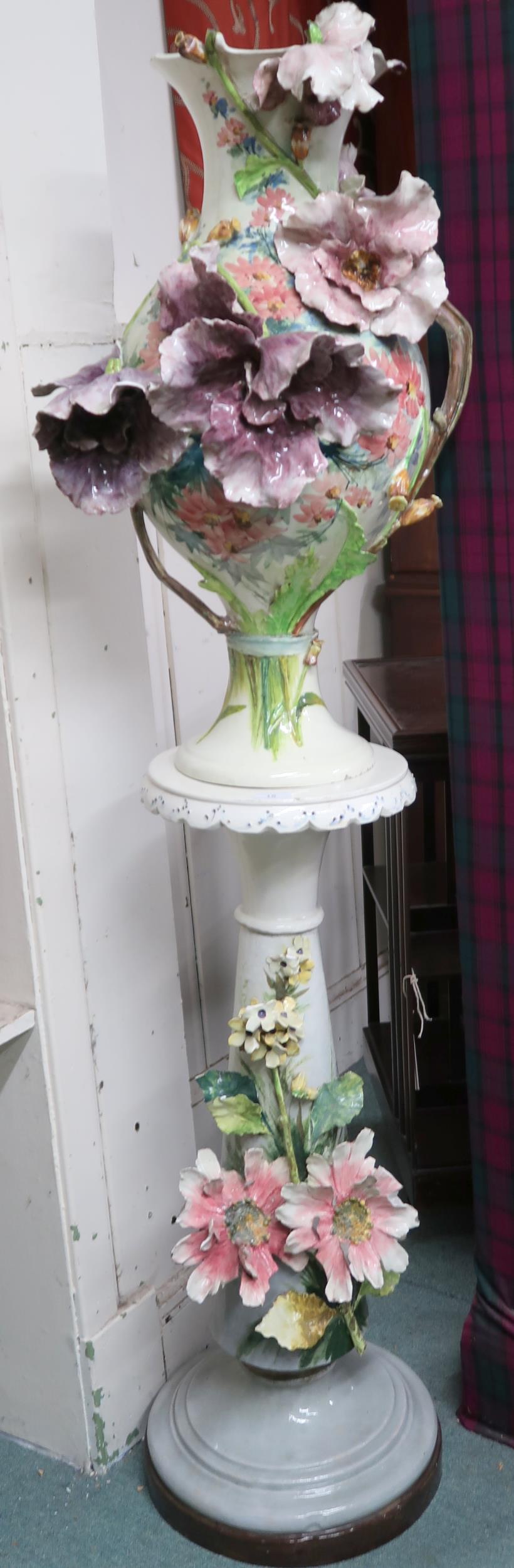 A 20th century ceramic floral pattern jardiniere on stand, 163cm high Condition Report:Available