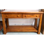 A contemporary teak console table with pair of drawers on square tapering supports joined by lower