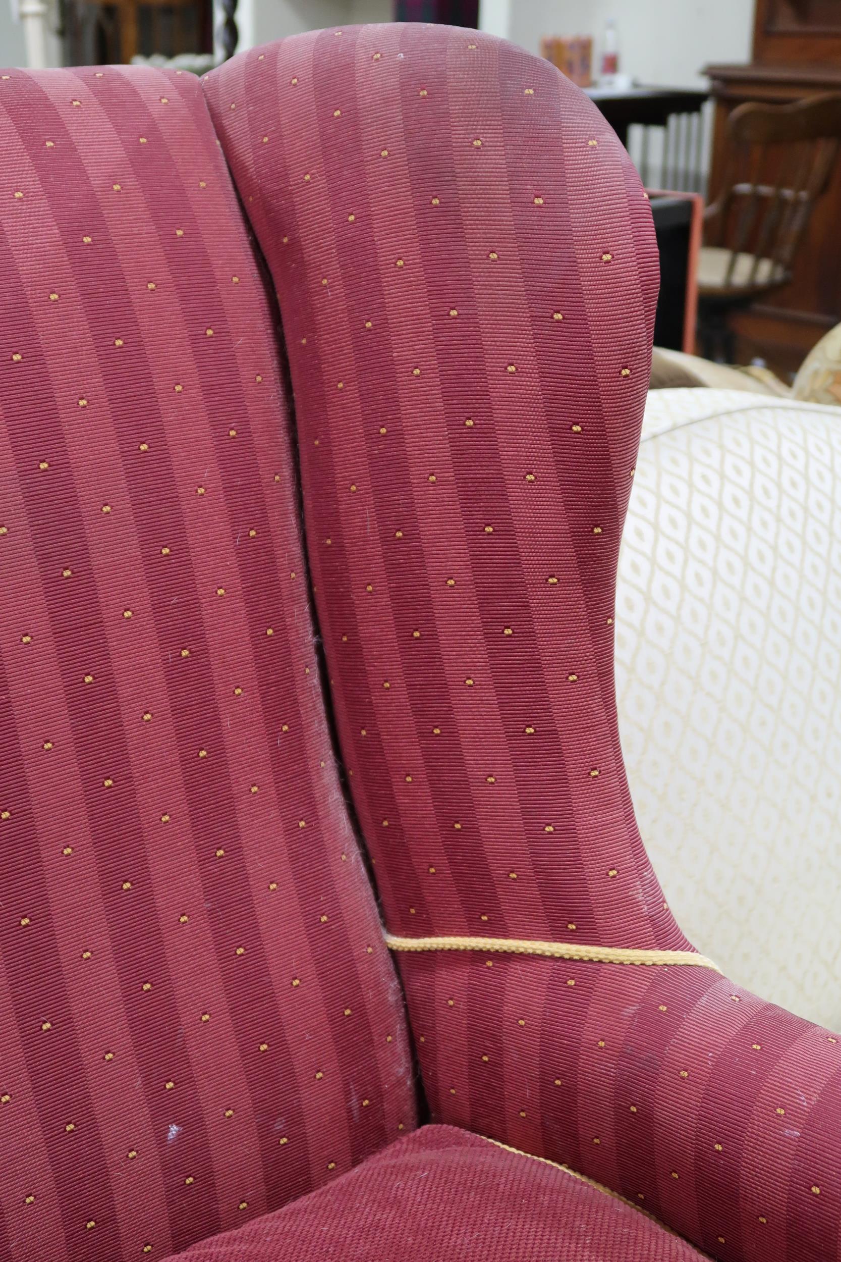 A Victorian wing back armchair with red striped upholstery on turned front supports, 110cm high x - Image 2 of 6