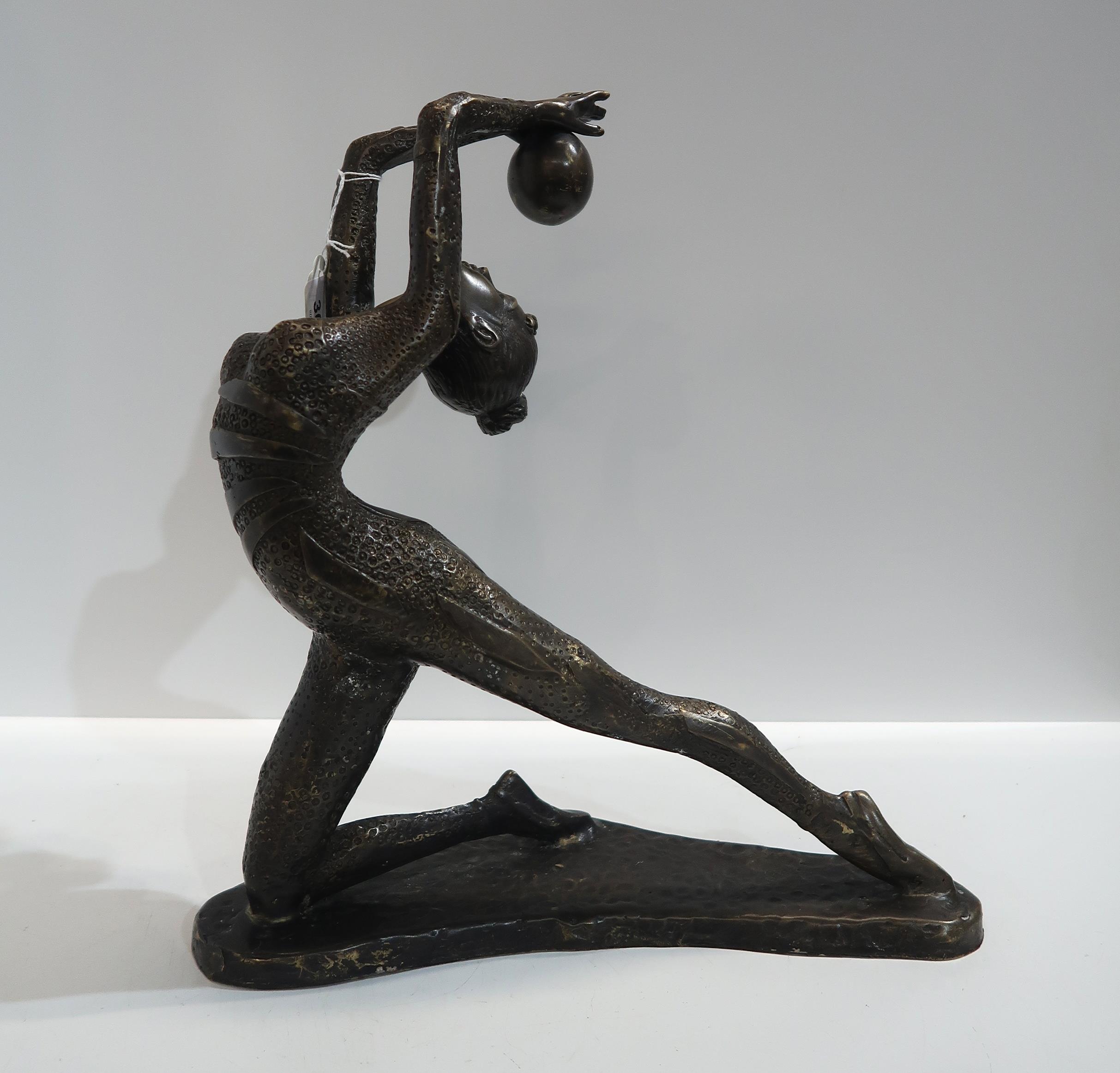 A contemporary patinated bronze of a dancer with a ball Condition Report:Available upon request