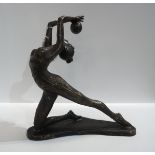 A contemporary patinated bronze of a dancer with a ball Condition Report:Available upon request