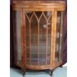 An early 20th century mahogany demilune glazed single door display cabinet, 120cm high x 89cm wide x