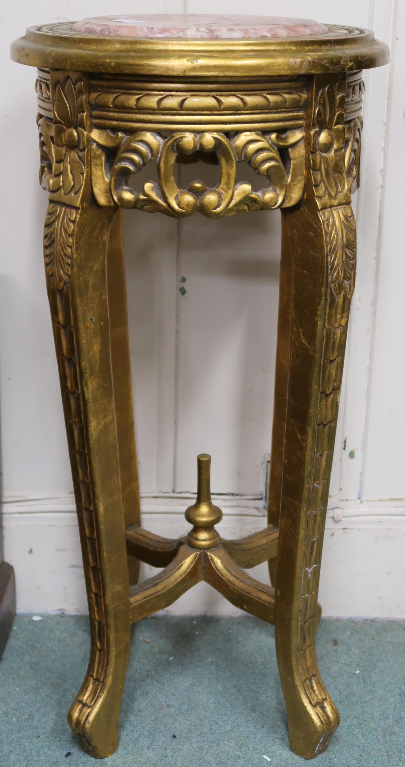 A late Victorian gilt framed jardinière stand with marble top over carved pierced friezes on