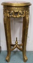 A late Victorian gilt framed jardinière stand with marble top over carved pierced friezes on