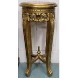 A late Victorian gilt framed jardinière stand with marble top over carved pierced friezes on