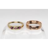 A 9ct rose gold wedding ring hallmarked Birmingham 1915, together with a 9ct gold ruby ring size