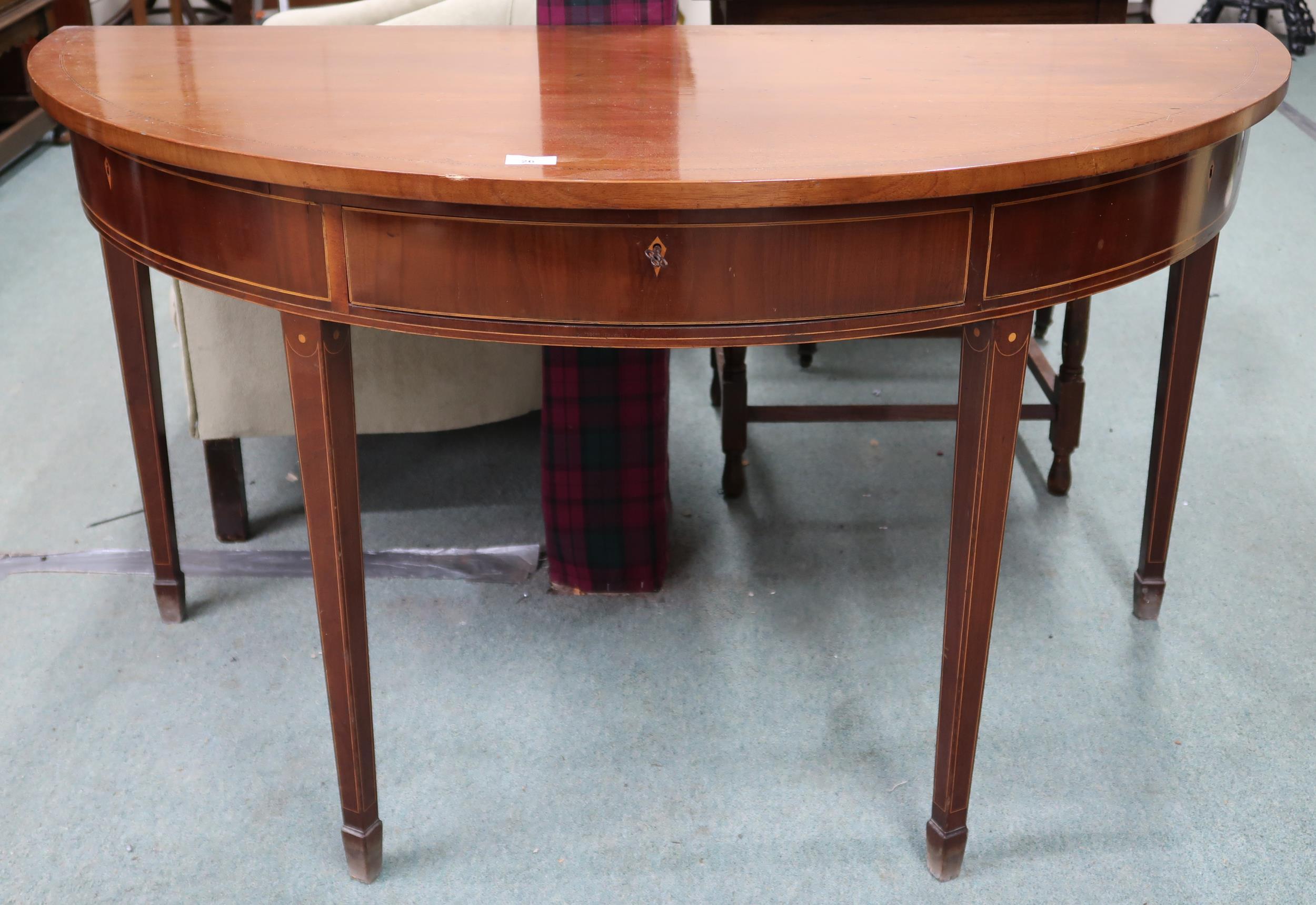 A late Victorian mahogany and satinwood inlaid demi lune table with single drawer flanked by faux
