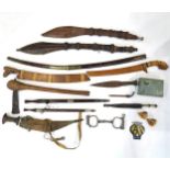 A Burmese dha sword, a Somali Gile, two Sudanese Manding swords and various other international