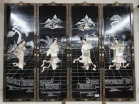 A 20th century black lacquer framed Chinese four panel wall decoration with faux mother pearl