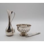 A collection of silver including a footed silver bowl, Birmingham 1934, the body partly fluted, a