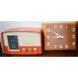 A 20th century HMV model 1373 radio and a teak wall clock (2) Condition Report:Available upon