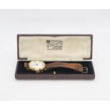 An 18ct gold gents Swiss watch, diameter 3.3cm, weight with strap and mechanism 36gms Condition