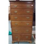 A 20th century mahogany tall chest of drawers with dentil cornice over six long drawers on bracket