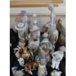 A collection of Lladro and Nao figures, a Royal Worcester Nun candlesnuff, and other figures
