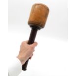 A turned lignum vitae masonry/woodworker's mallet, measuring approx. 35cm in overall length