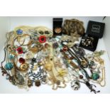 A collection of vintage costume jewellery to include a Russian brooch, Wolf cub Scouts badge, a