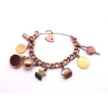 A 9ct gold charm bracelet, to include a 1 Pound coin and a 1913 gold half sovereign (both with