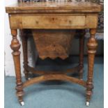 A Victorian walnut and parquetry inlaid games/sewing table with fold-over top baized lining over