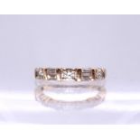 A 14k gold baguette and brilliant cut diamond ring, set with estimated approx 0.40cts, size L1/2,
