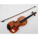 A two piece back violin 35.5cm together with a bow 56 grams Condition Report:Available upon request