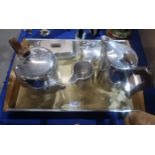 A four piece Picquotware teaset on tray and a stainless steel butter dish Condition Report:Available