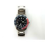 A Stainless steel Seiko Sports Automatic with an exhibition back Condition Report:Winds and is