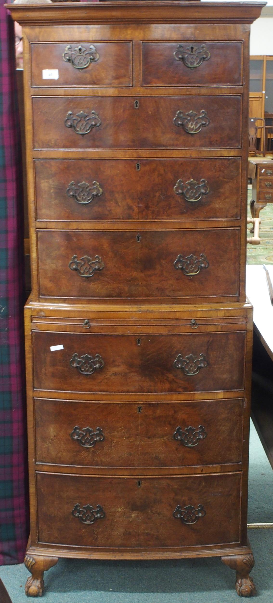A 20th century mahogany chest on chest with moulded cornice over two short over three long drawers