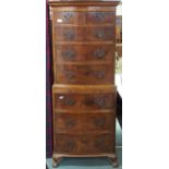 A 20th century mahogany chest on chest with moulded cornice over two short over three long drawers