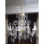 A 20th century Venetian style eight branch chandelier with scrolled glass arms Condition Report: