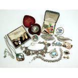 A silver charm bracelet with some good large charms to include the old woman that lived in a shoe,