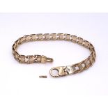 A 9ct yellow and white gold fancy bracelet, length 20.5cm, weight 15.4gms Clasp (af) Condition