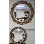 A lot of two assorted circular gilt framed wall mirrors (2) Condition Report:Available upon request