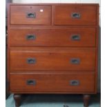 A 20th century stained teak campaign style chest of drawers with two short over three long drawers