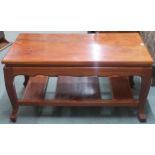 A 20th century hardwood two tier coffee table, 49cm high x 101cm long x 61cm deep Condition Report: