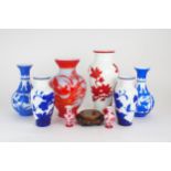 A collection of modern Peking glass including a pair of cobalt blue overlay examples, carved with