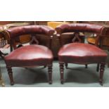 A pair of early 20th century tub armchairs with rexine upholstery on turned supports, 79cm high x