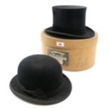 A silk top hat by Dunn & Co., size 6 7/8, in box, together with a similarly sized bowler hat by