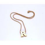 An Italian 18ct gold rope chain and 'R' pendant, length of chain 43cm, weight 10.8gms Condition