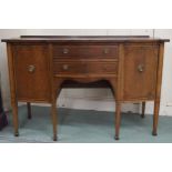 An early 20th century mahogany serpentine front sideboard with pair of central drawers flanked by