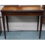 A Victorian mahogany fold-over tea table on square tapering supports, 73cm high x 91cm wide x 46cm