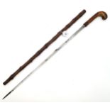 A gnarled wood sword stick, the concealed blade measuring approx. 71cm in length, the whole