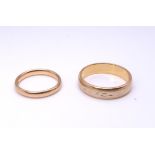 Two 18ct gold wedding rings, sizes S1/2, and L, weight together 8.2gms Condition Report:Available