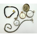 An open face white metal pocket watch in a Miner's case, with integral compass built into the