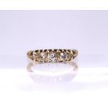 An 18ct gold five diamond ring, set with estimated approx 0.50cts of old cut diamonds, classic