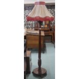 A mahogany turned reeded standard lamp, 178cm high Condition Report:Available upon request